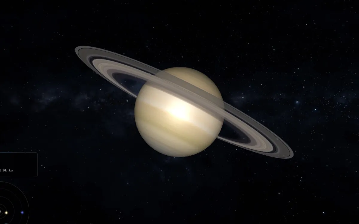 Saturn and its rings rendered against a starfield.